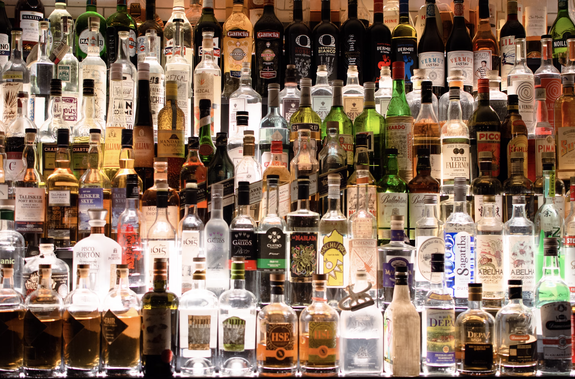 Dramatic lighting showcasing premium spirits authentication